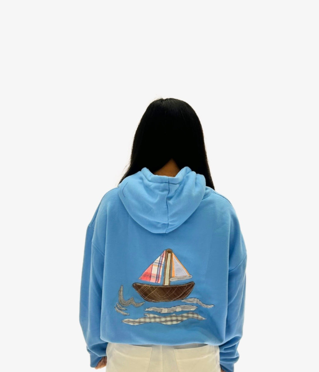 “LAYAG” in blue hoodie
